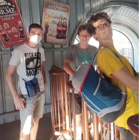 Three boys at the top of the stairs
