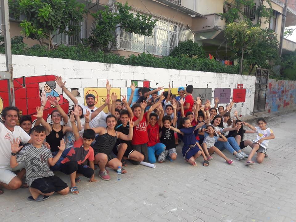 Peace School Turkey group photograph against a wall